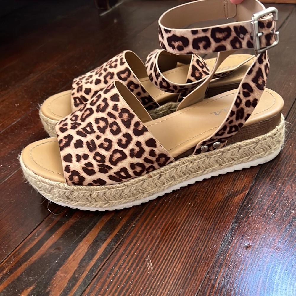 Brown and tan cheetah print platform sandals with ankle strap